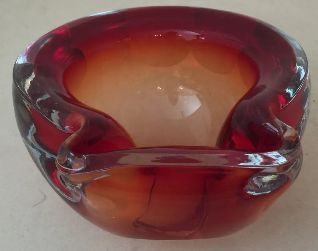 murano glass bowl in amber and red tones