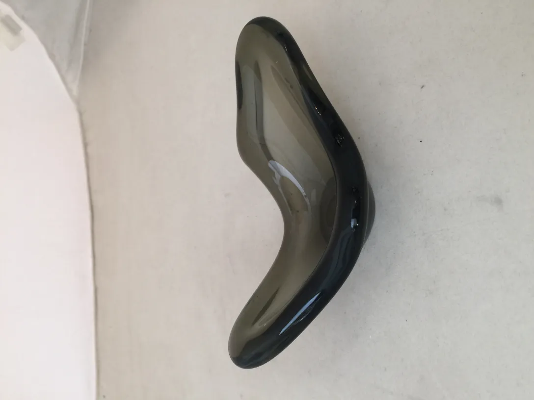 decorative murano glass piece with soft curves and dark hues