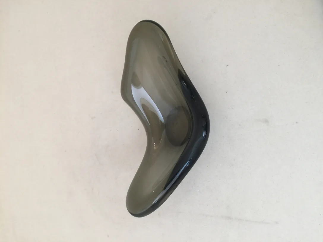 Antique Murano glass piece with elegant shape and dark colors.