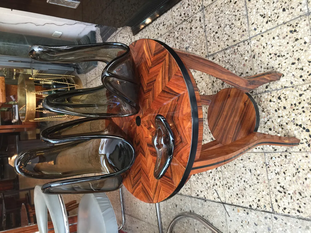 antique murano glass in wavy shape on wooden table