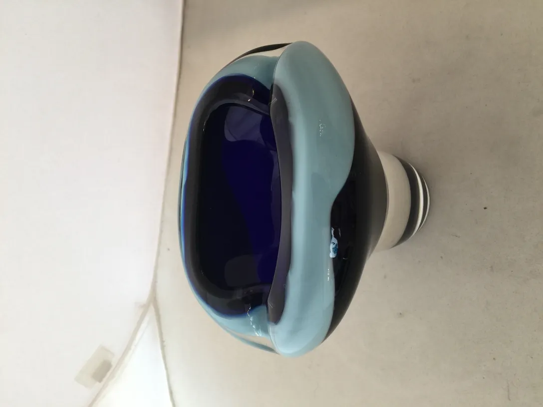 decorative murano glass piece with wavy shape and blue-black colors