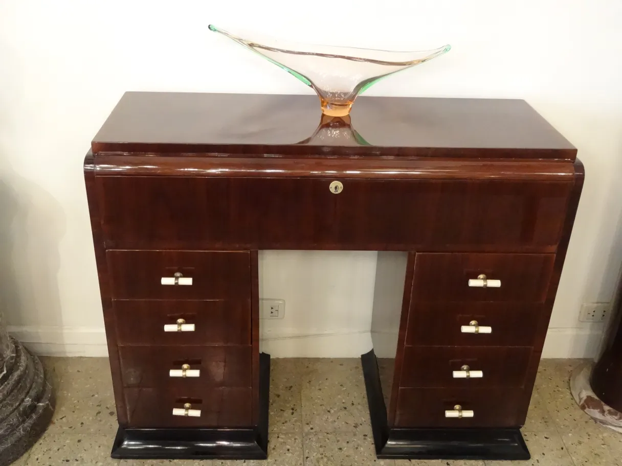 Antique Murano glass with colorful details on elegant furniture