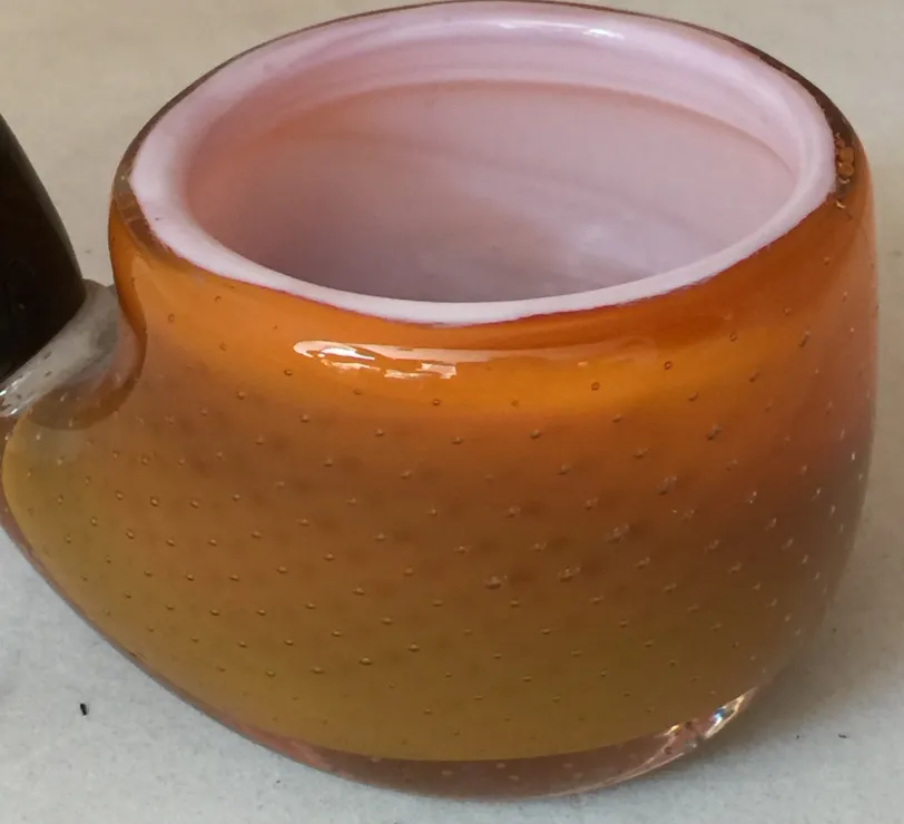 Antique Murano glass decoration in amber and pink shades.