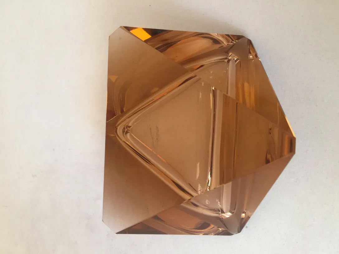 Antique Murano glass in golden color with geometric shapes.