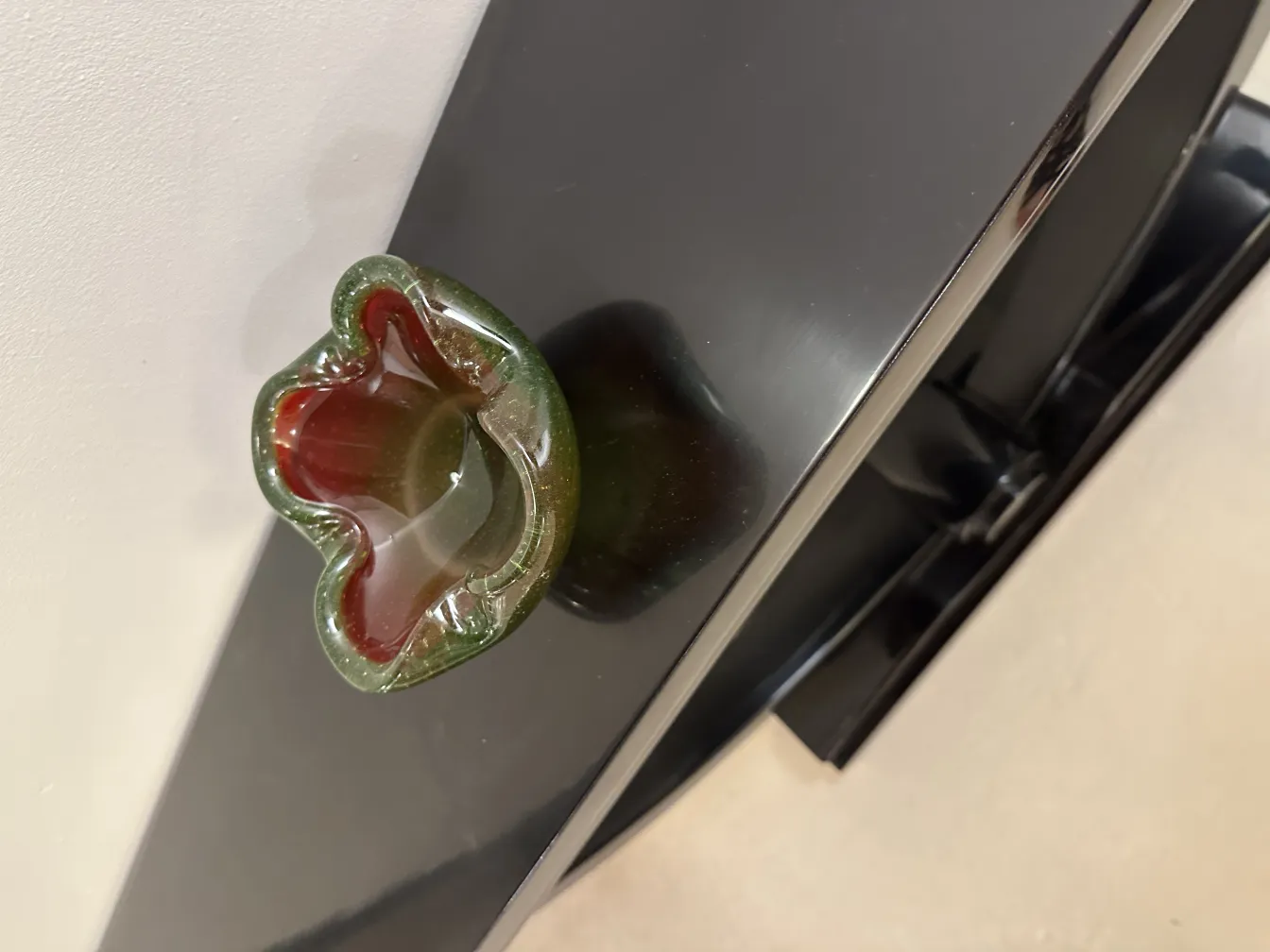 antique murano glass with green and red tones in a unique design