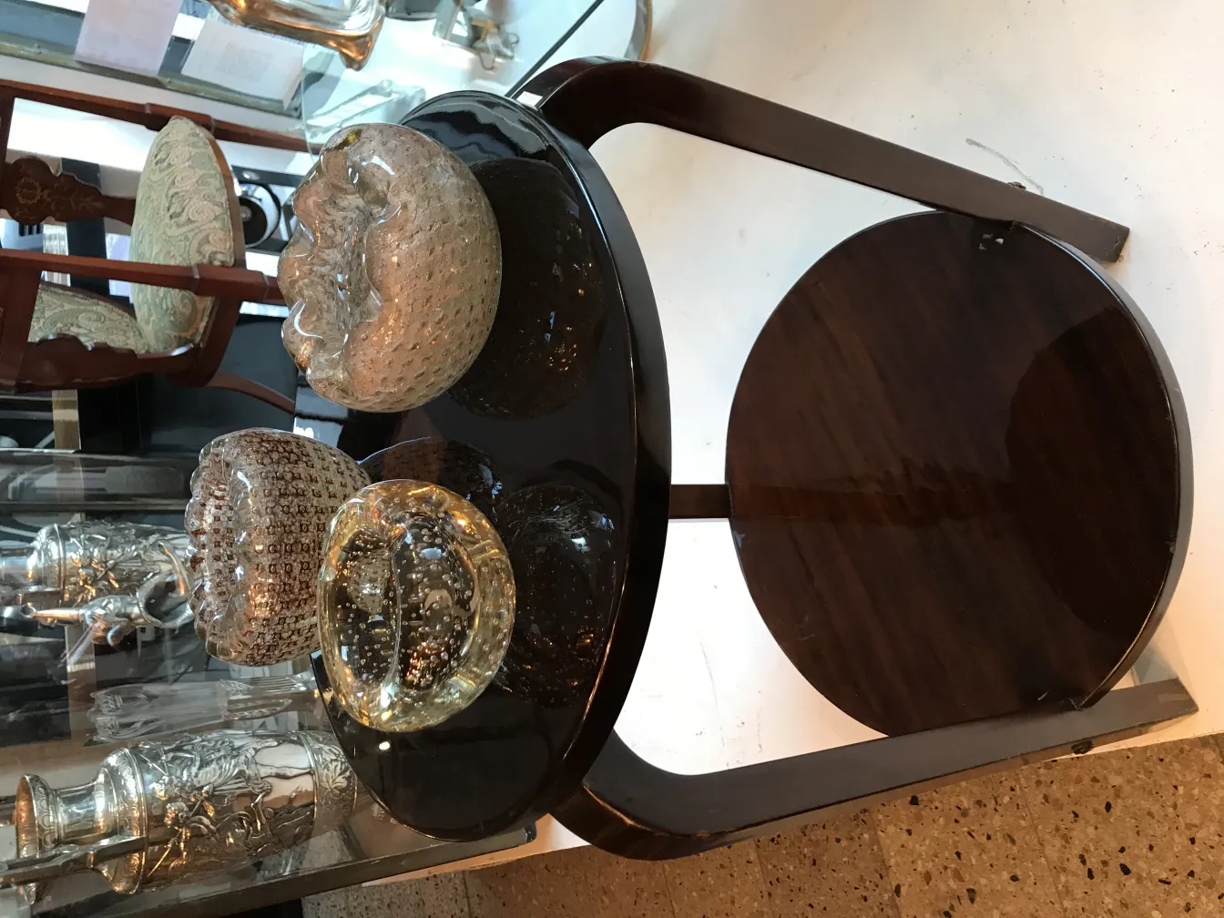 three murano glass vases on a table