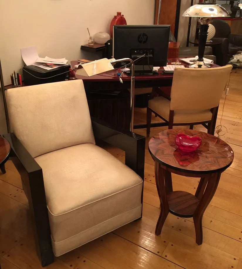 red murano glass on round table by an armchair