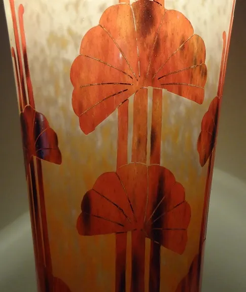 Antique signed glass with floral design in warm colors.