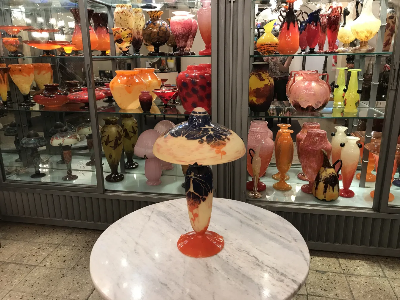 signed glass decorated with patterns in an antique setting