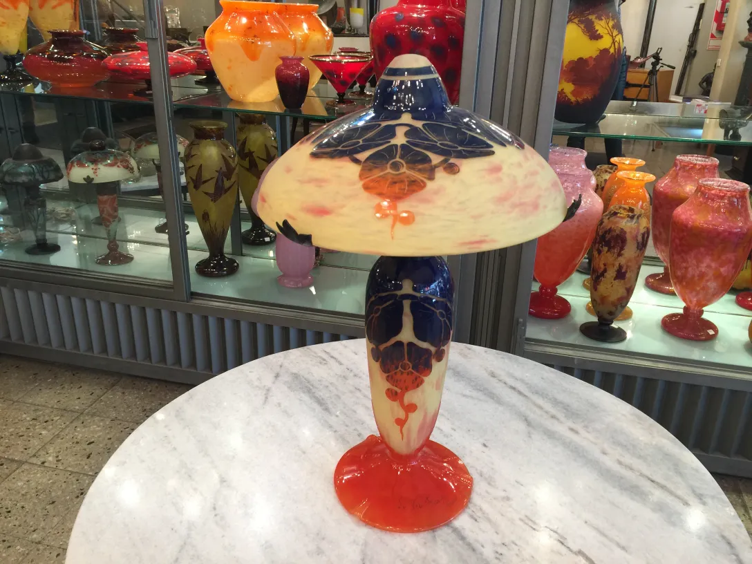 Antique lamp with red base and blue details