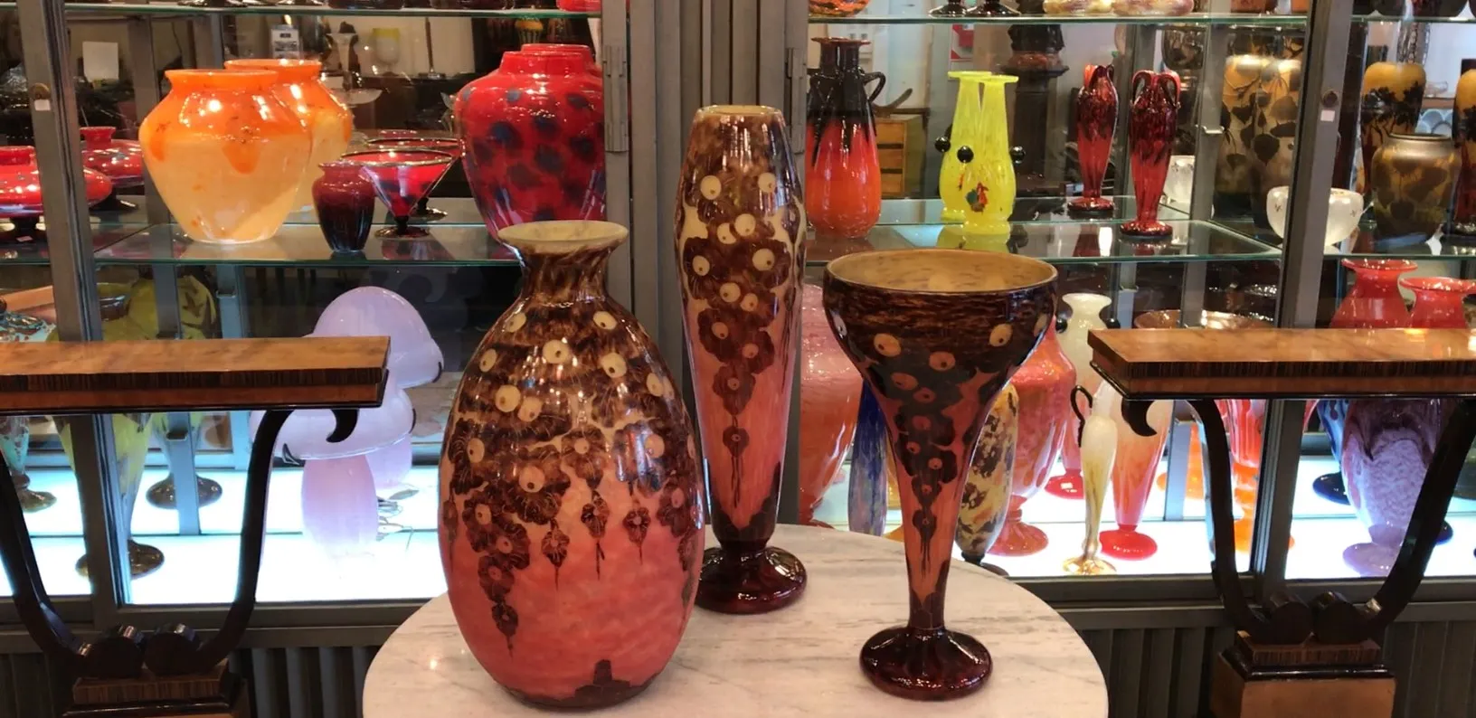 Antique signed glass Le Verre featuring colorful decorative elements.