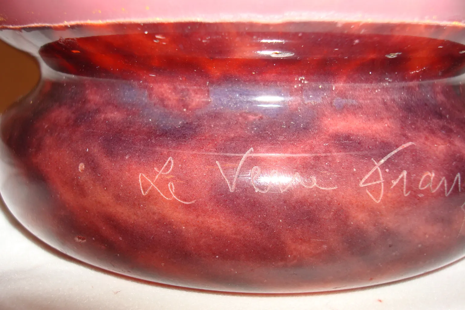 signed glass with red and purple details