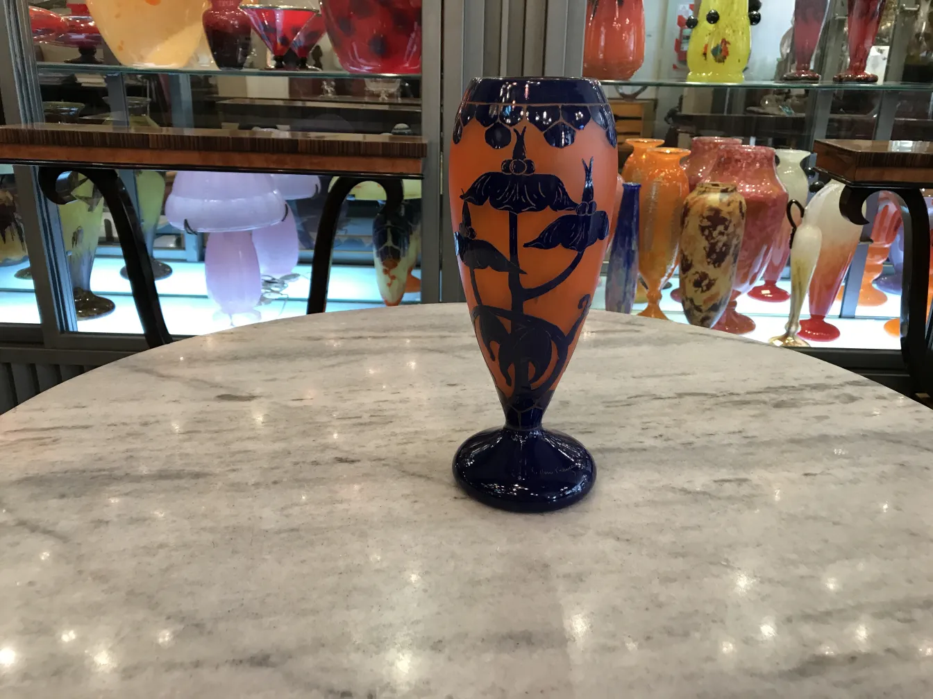 Antique signed glass Le Verre with floral decorations in blue and orange.