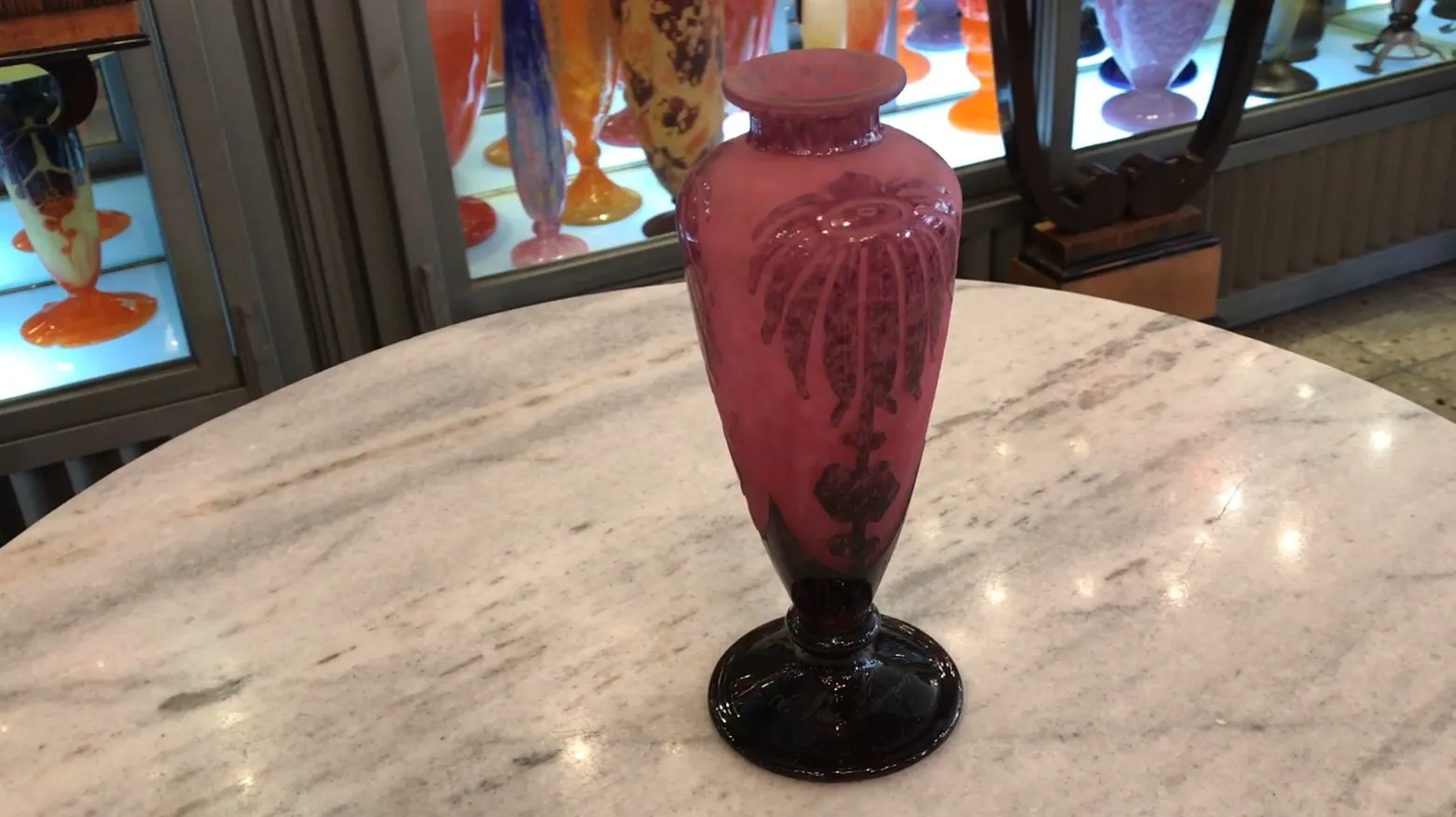 beautiful antique glass vase with decorative patterns on a light background