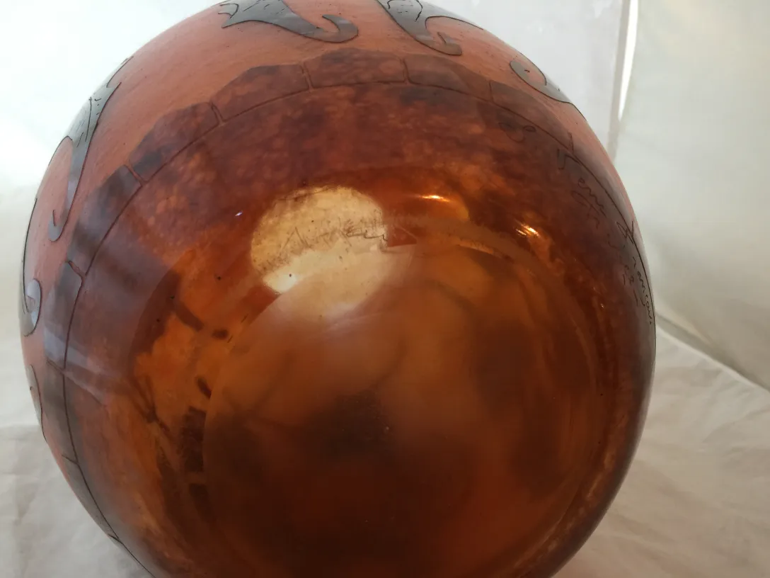 Antique glass with signature and decorative details