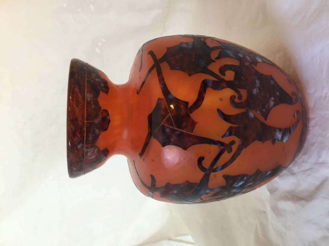 Signed glass Le Verre with floral design in warm tones.