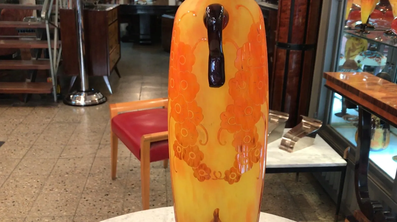 Antique signed glass Le Verre with floral design in yellow and orange tones.