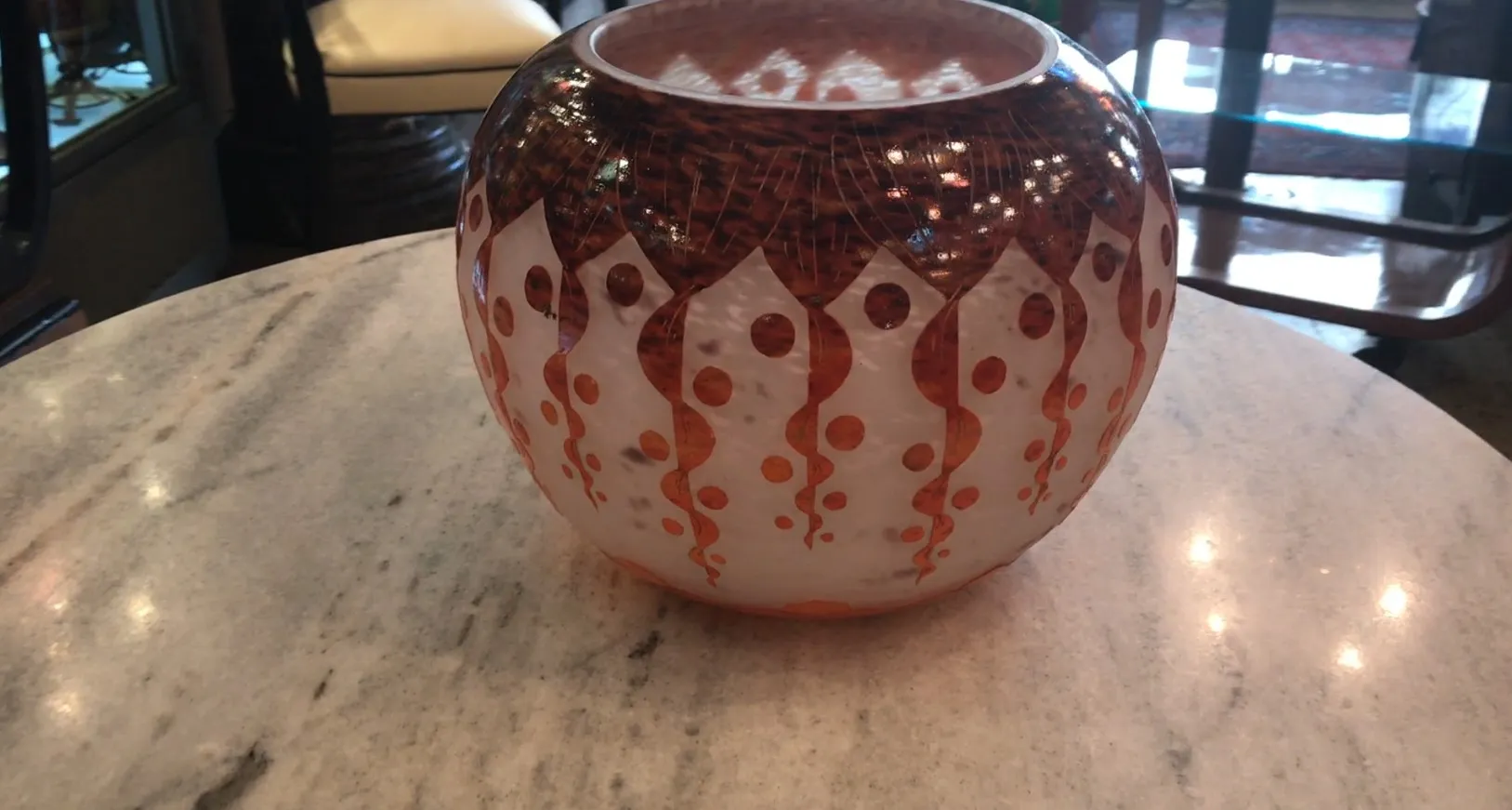 SIGNED GLASS Le Verre with intricate design on a table