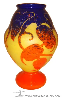 Antique vase with vibrant leaf motifs.