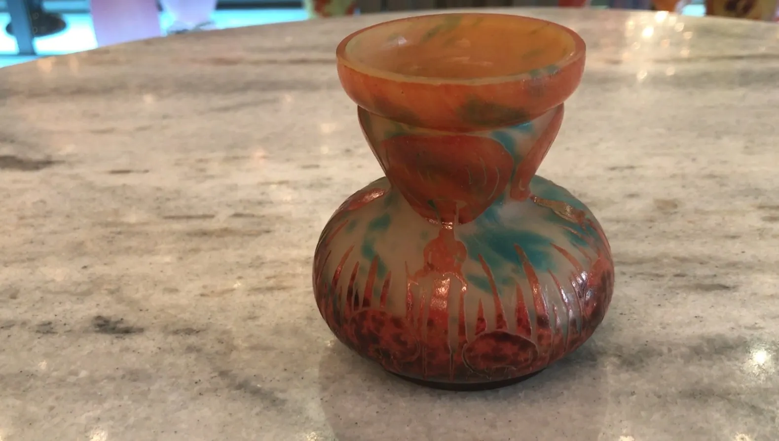 Antique glass piece with vibrant colored designs