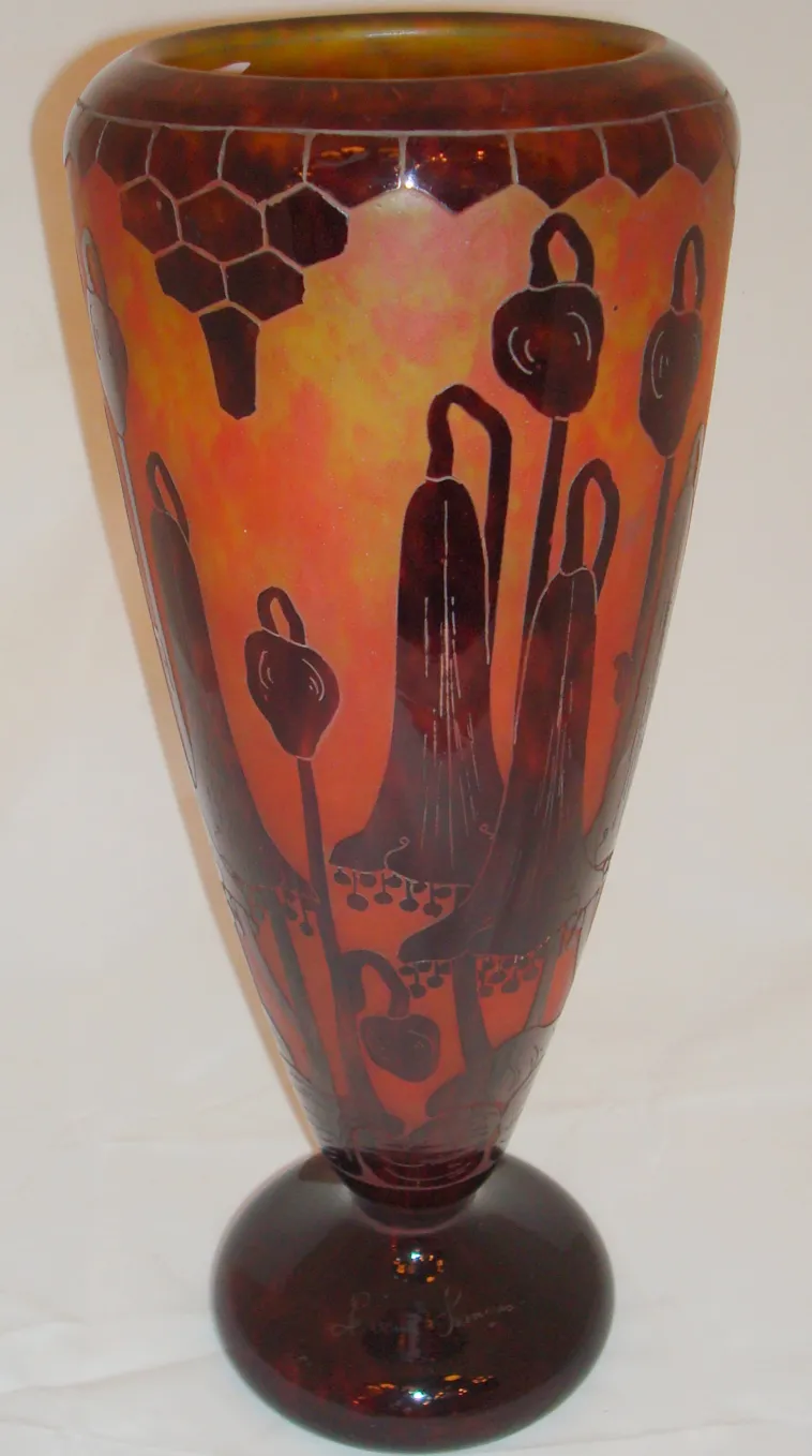 antique glass vase with floral design and signature