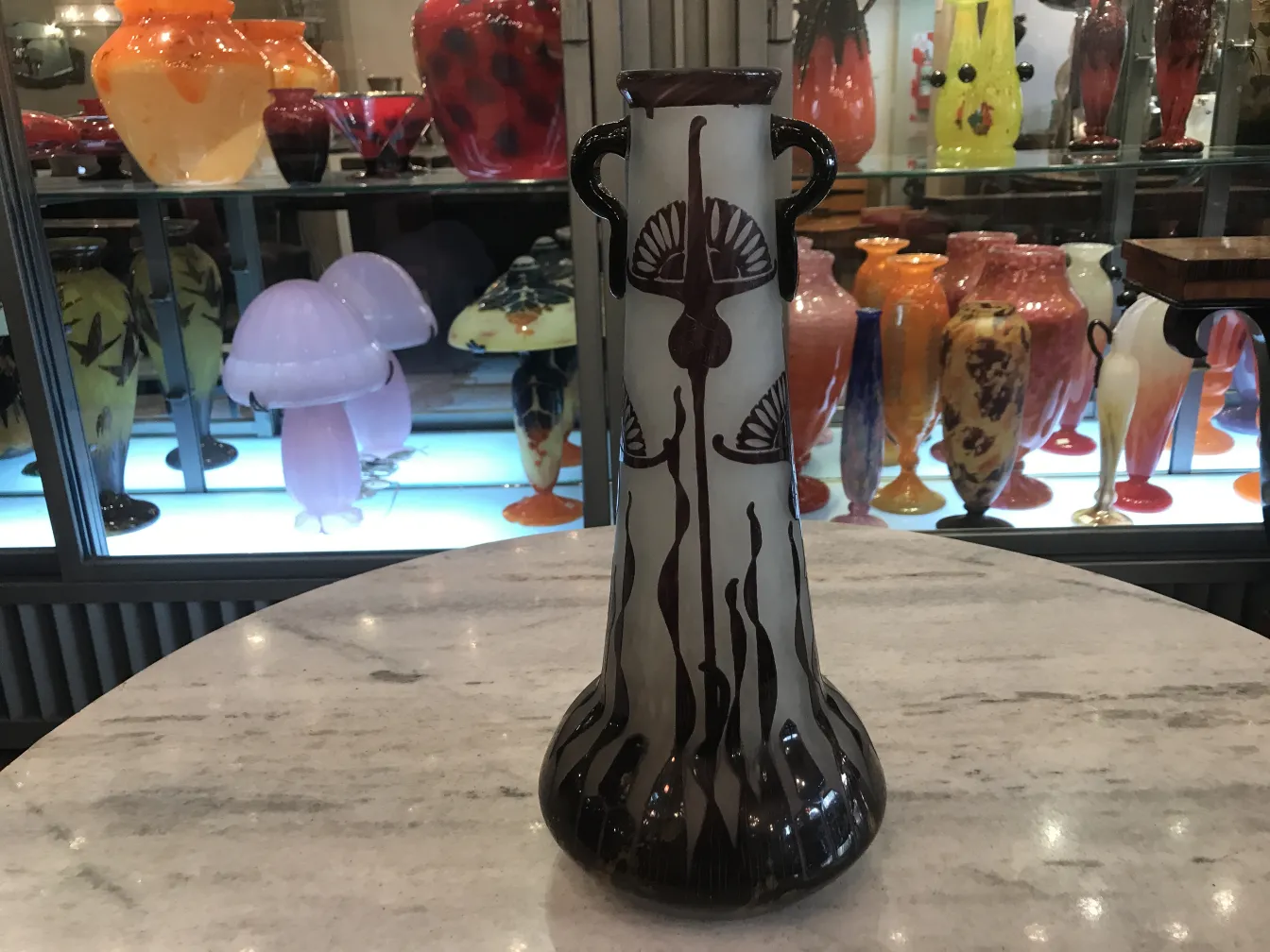 vase with designs in an antique setting, antiques around