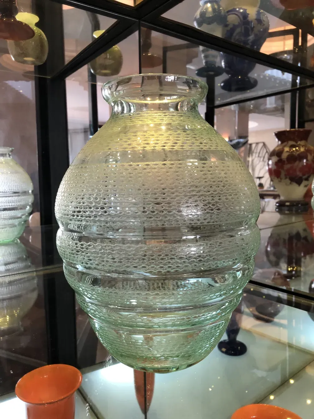 Signed glass by Daum Nancy featuring distinctive design in an antique setting.