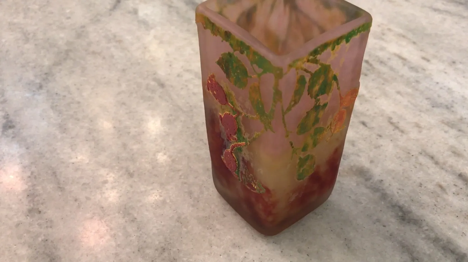 Signed Daum Nancy glass with floral design on pink background