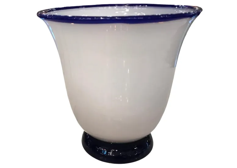 Glass jar with blue rim and classic appearance on a white background.