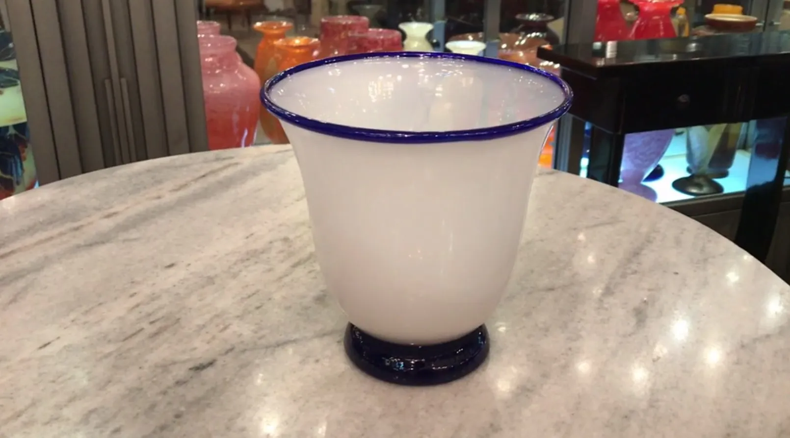 Antique signed glass from Daum Nancy with a blue rim