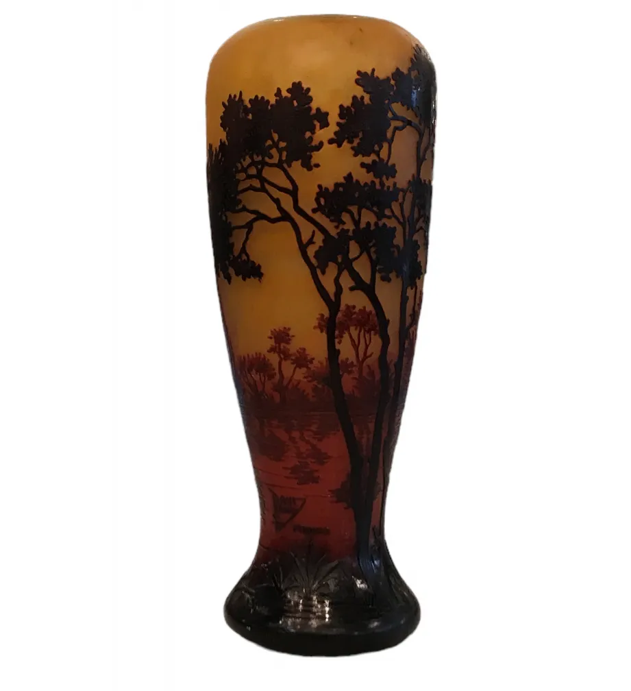 SIGNED GLASS by Daum Nancy with tree design on orange and red background.