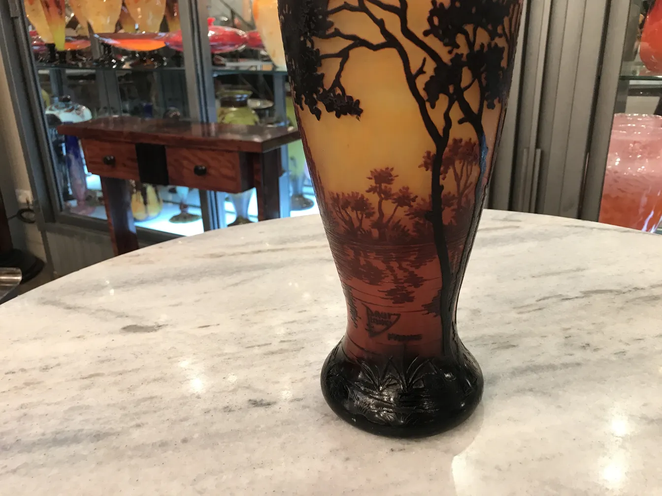 Antique signed glass Daum Nancy in an elegant setting with tree engravings.