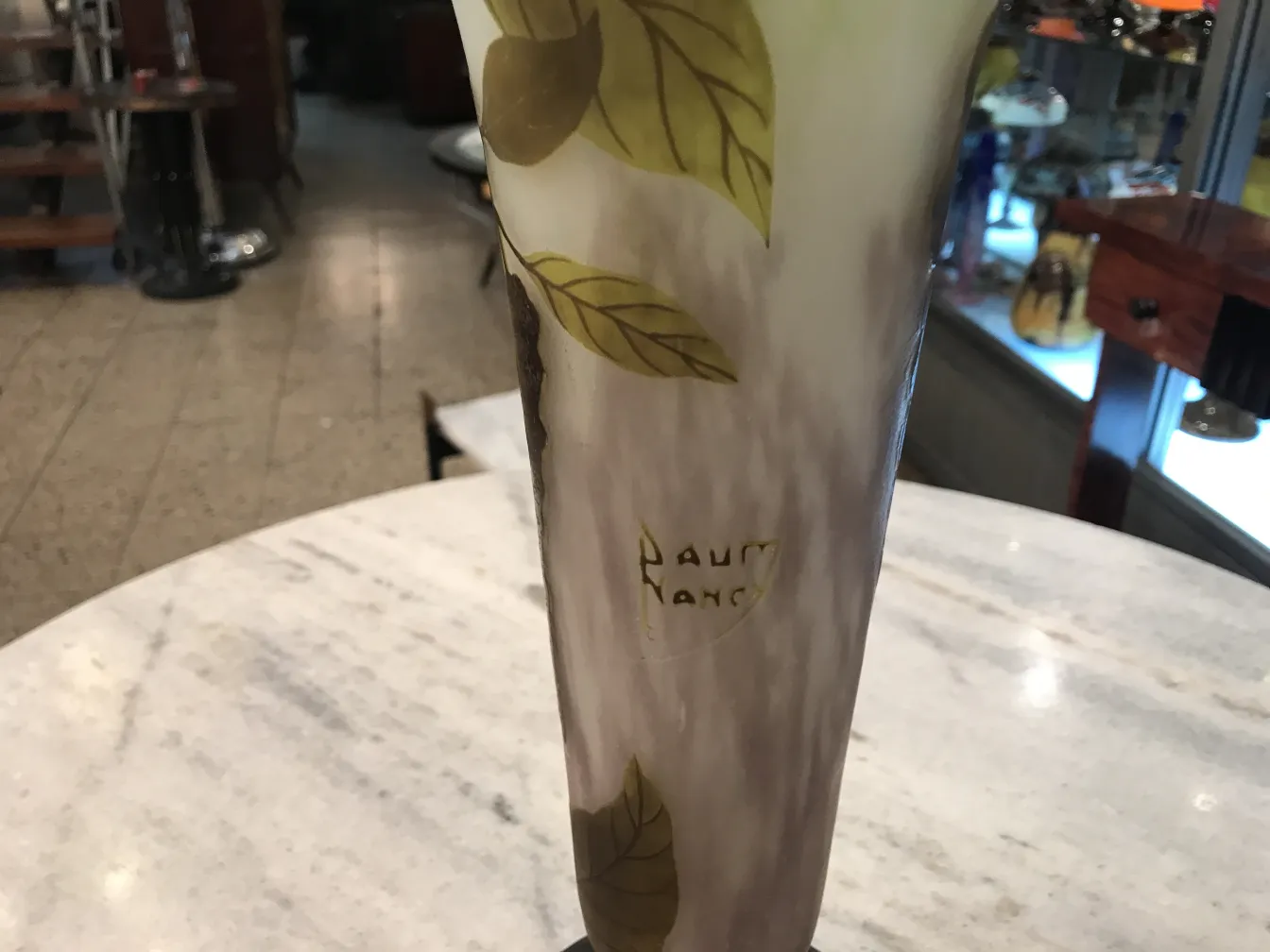 Antique signed glass by Daum Nancy featuring decorative leaves in an antique setting