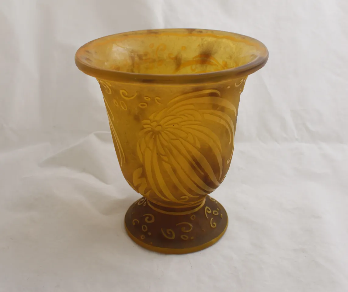 Antique glass vase signed Daum Nancy with decorative amber design.