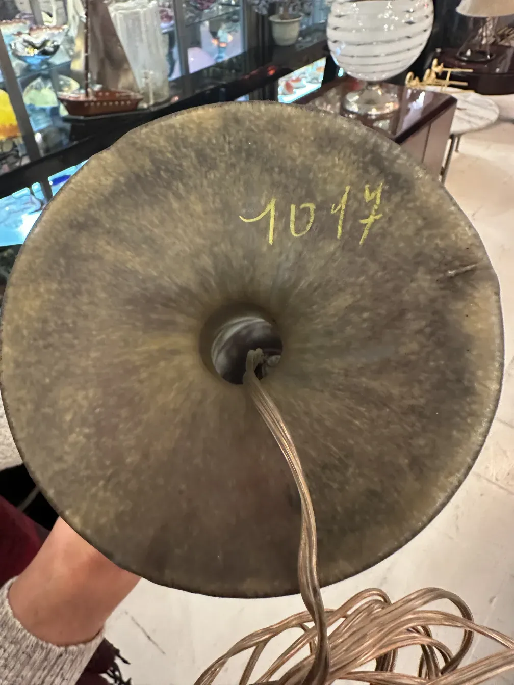 Top view of an antique signed glass Daum Nancy with cord