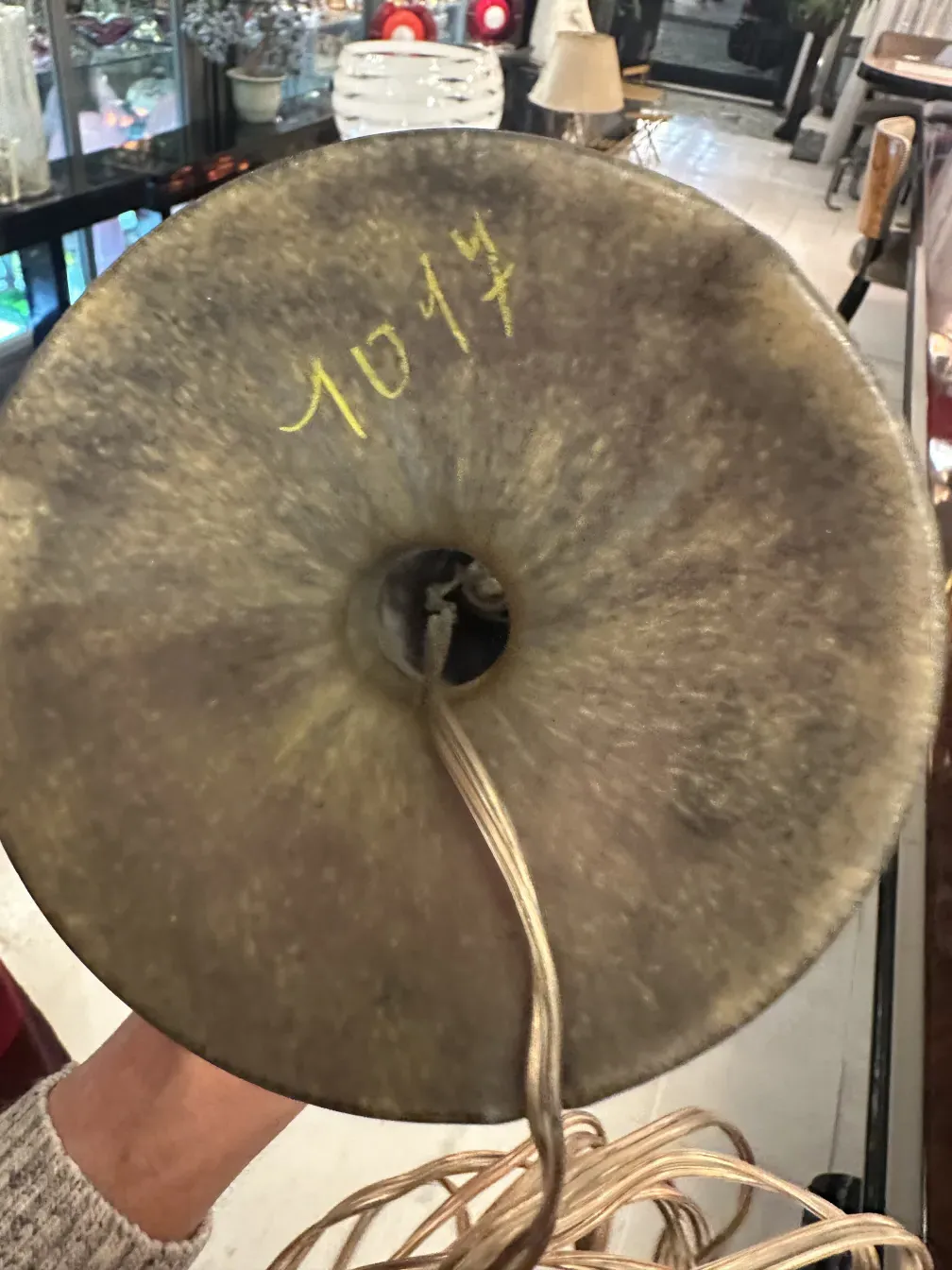 Top view of an antique with visible signature in yellow