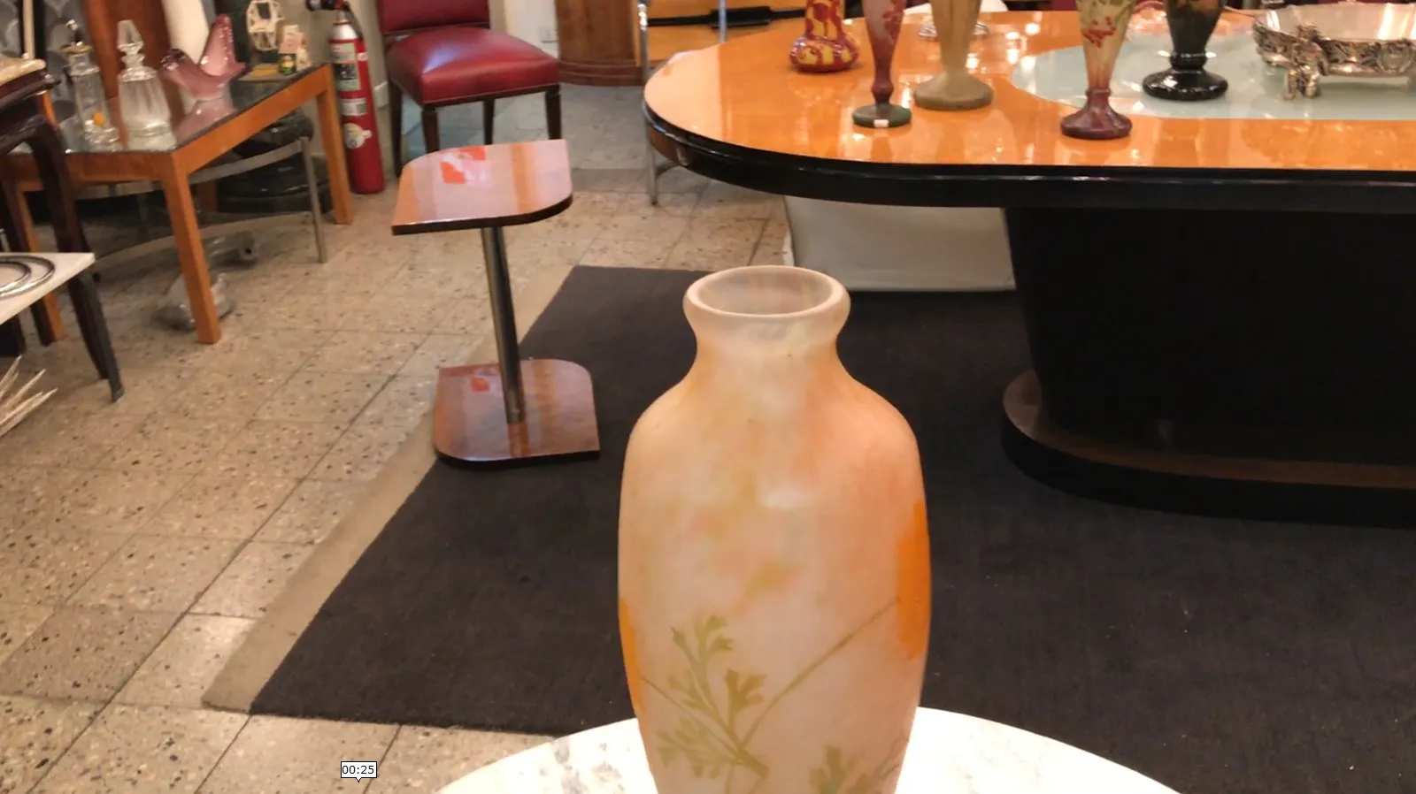 Antique vase signed in peach color with yellow details on light background