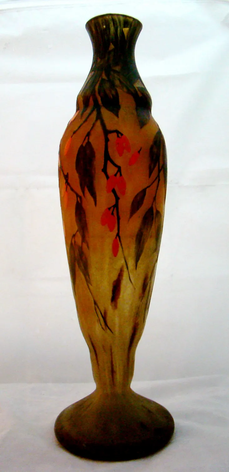 antique bottle with signature, decorated with branches and leaves