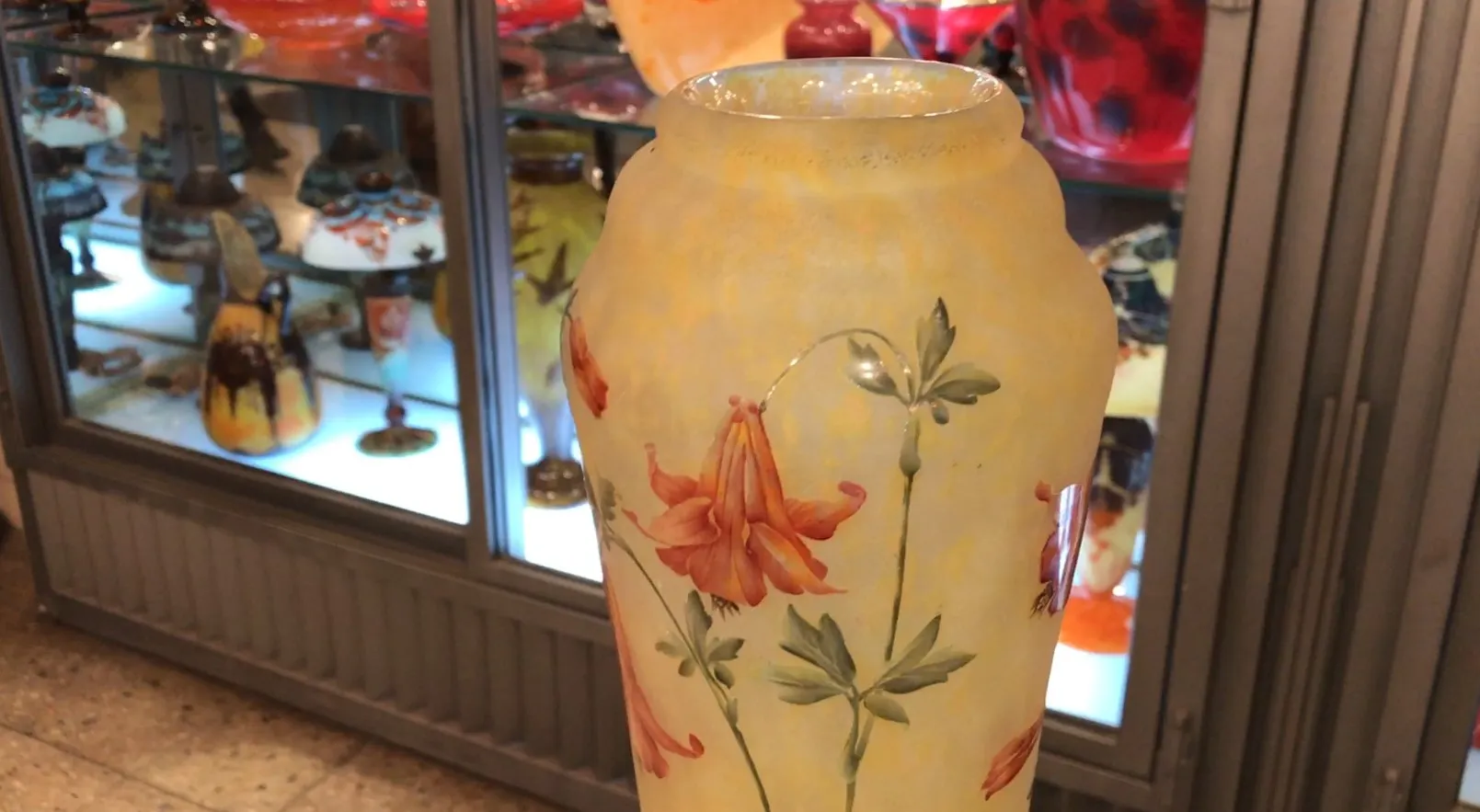 Antique glass vase signed Daum Nancy featuring floral designs