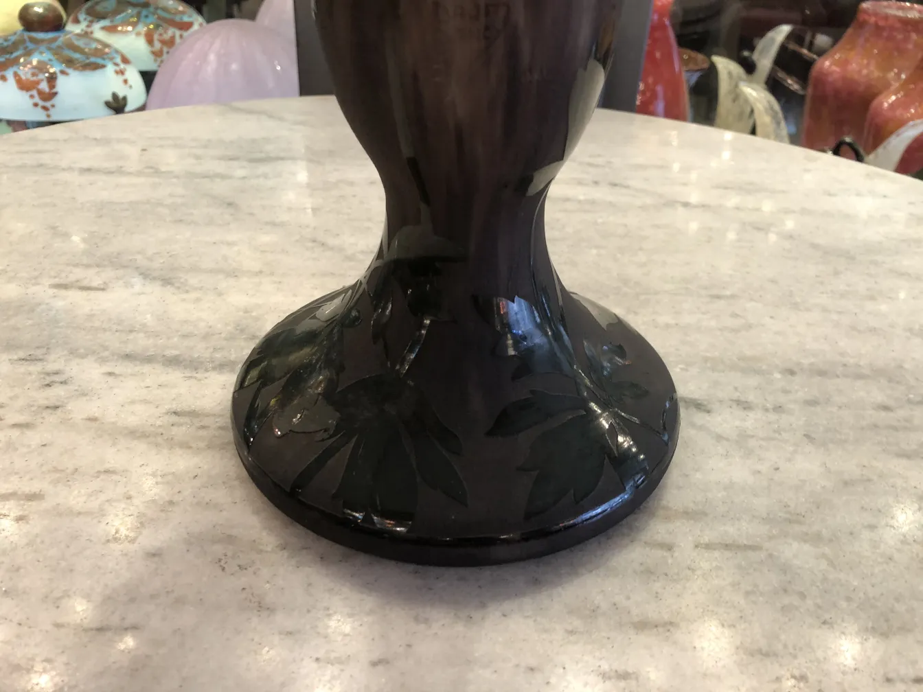 base of signed glass daum nancy in an antique setting