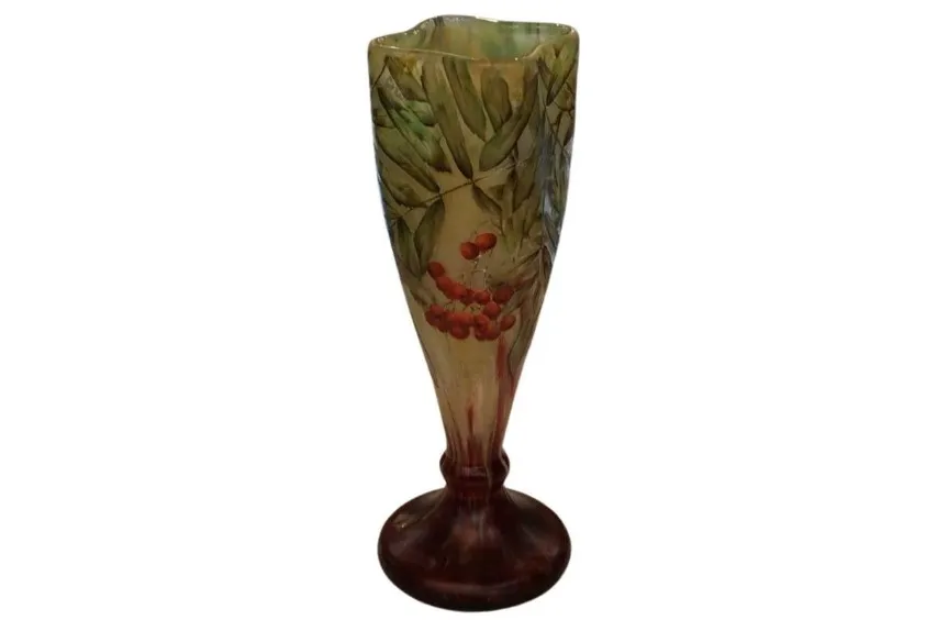 Daum glass featuring leaves and red berries on a light background.