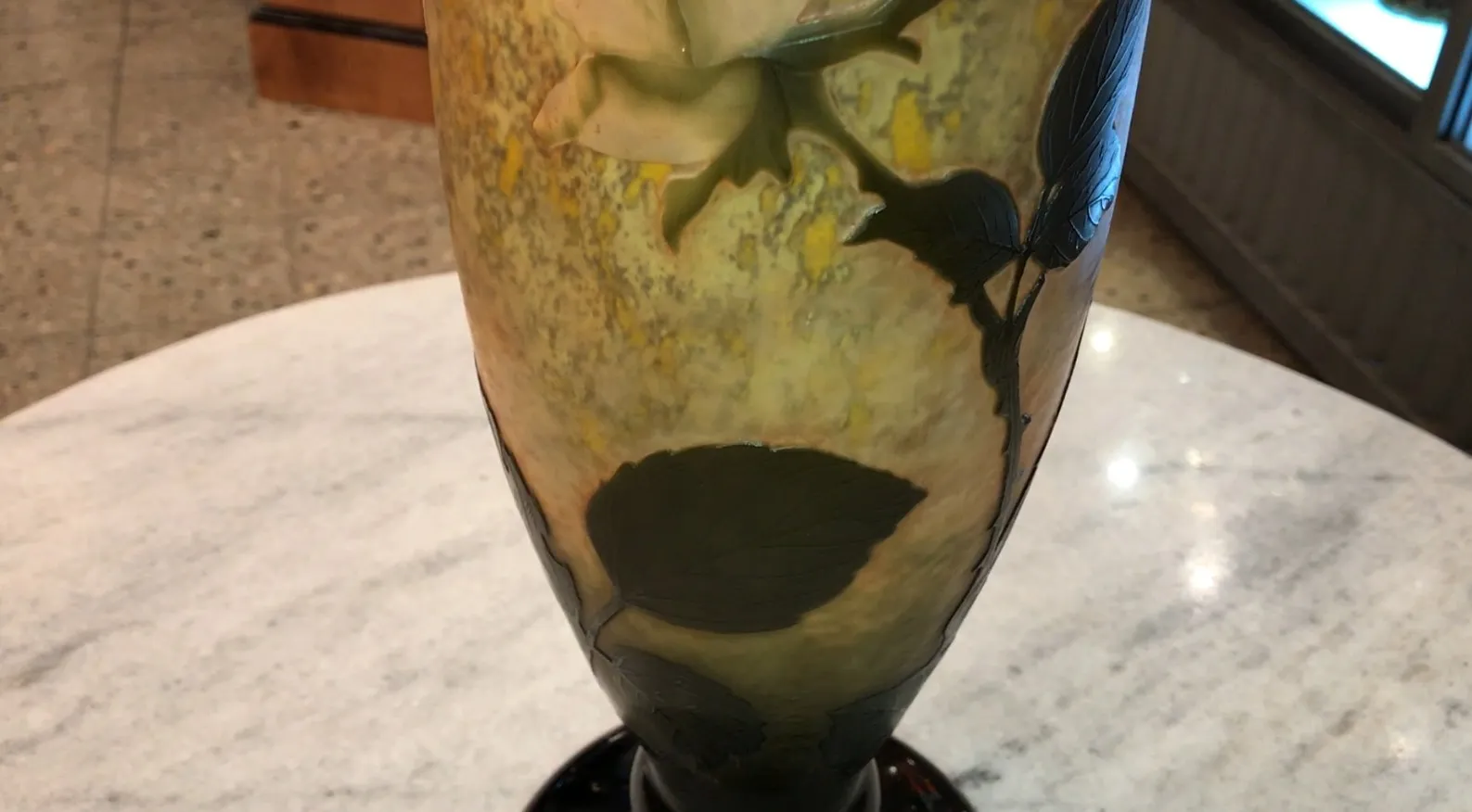 signed glass daum nancy featuring an antique floral design in warm colors