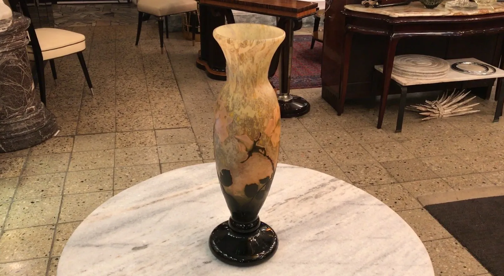 Glass vase signed Daum Nancy with floral design in antique setting.