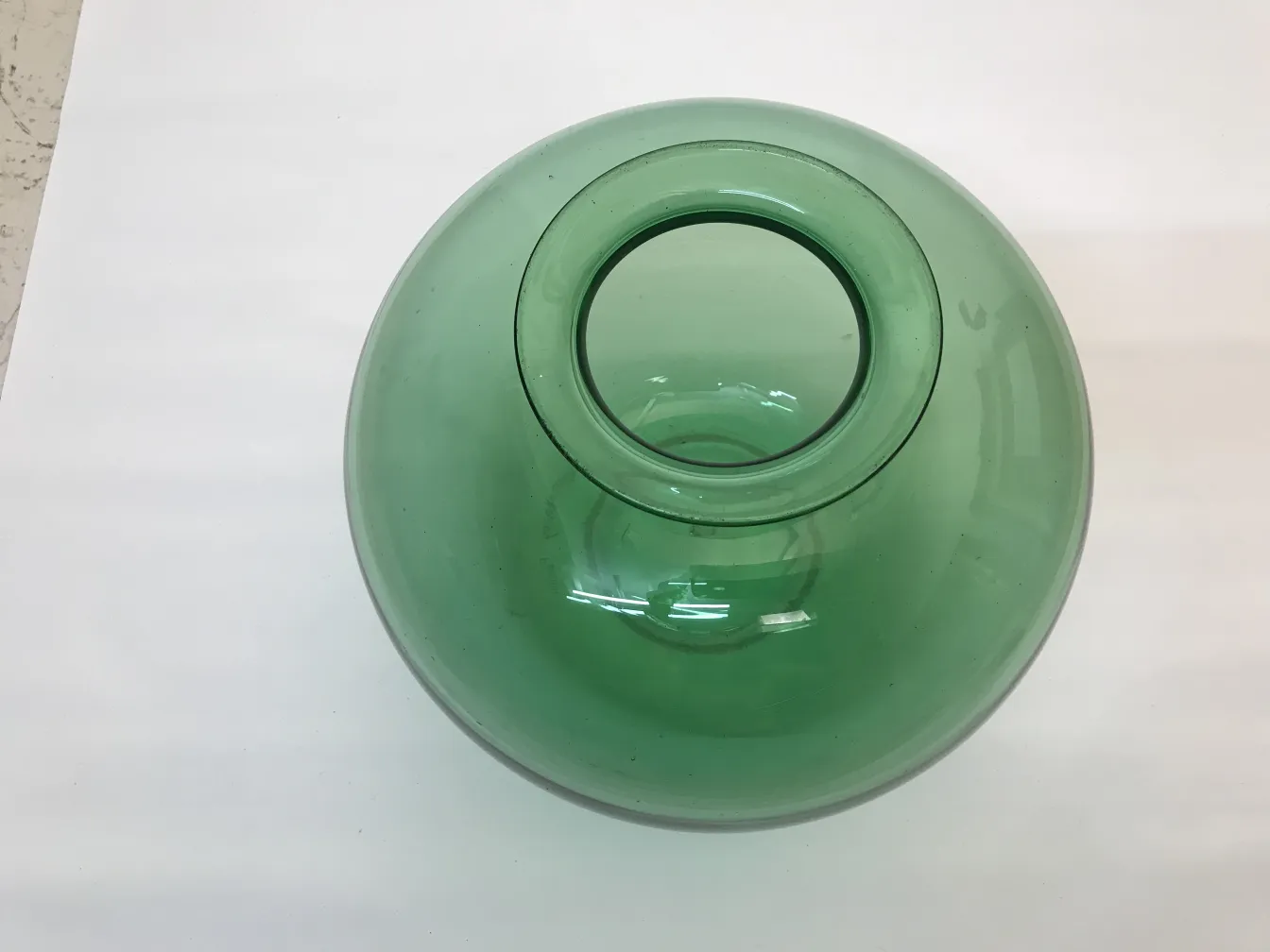 light green glass with a circular opening on top
