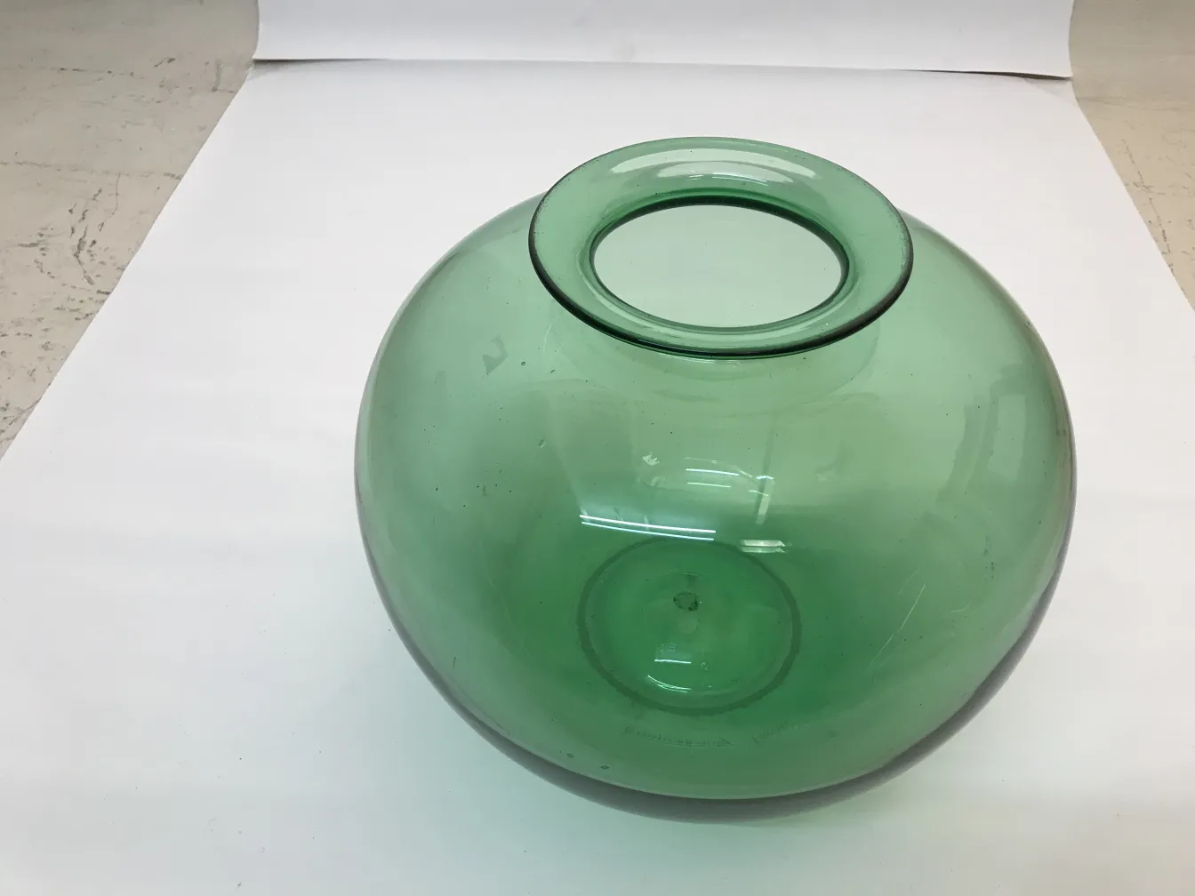 green signed glass vase on white background
