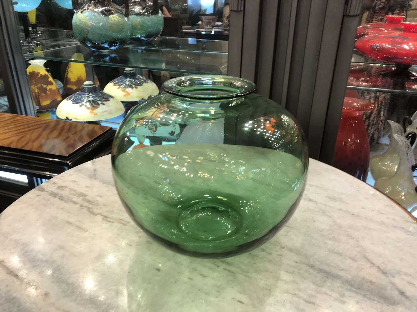 antique round glass piece in green, decorative setting