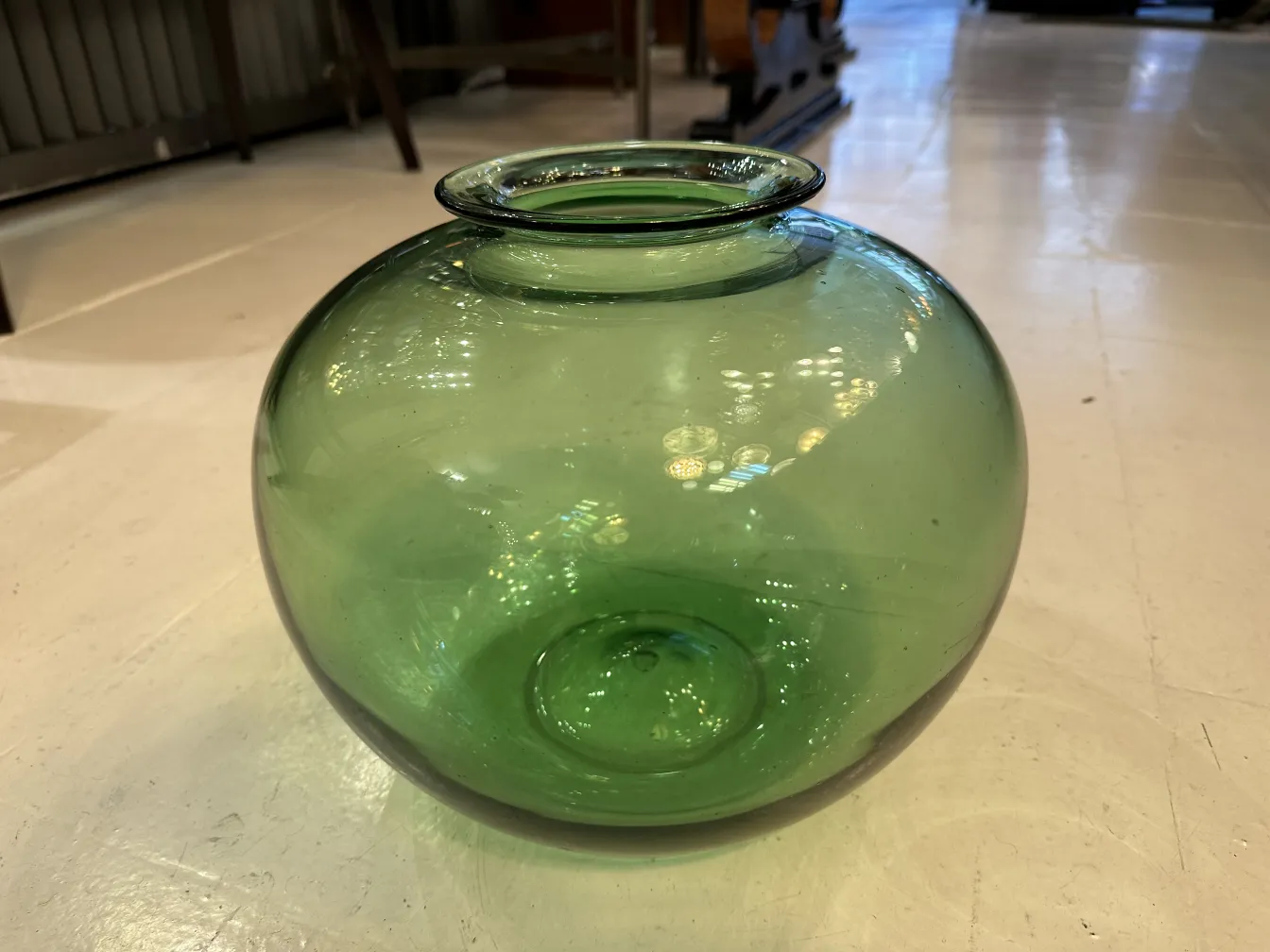 rounded green signed glass daum nancy in an antique setting
