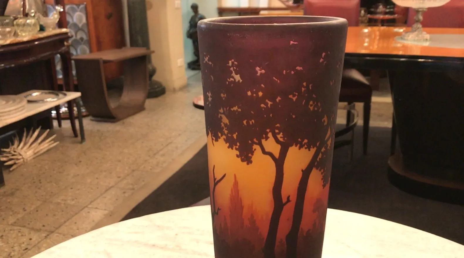 Signed glass Daum Nancy featuring a warm tree design.