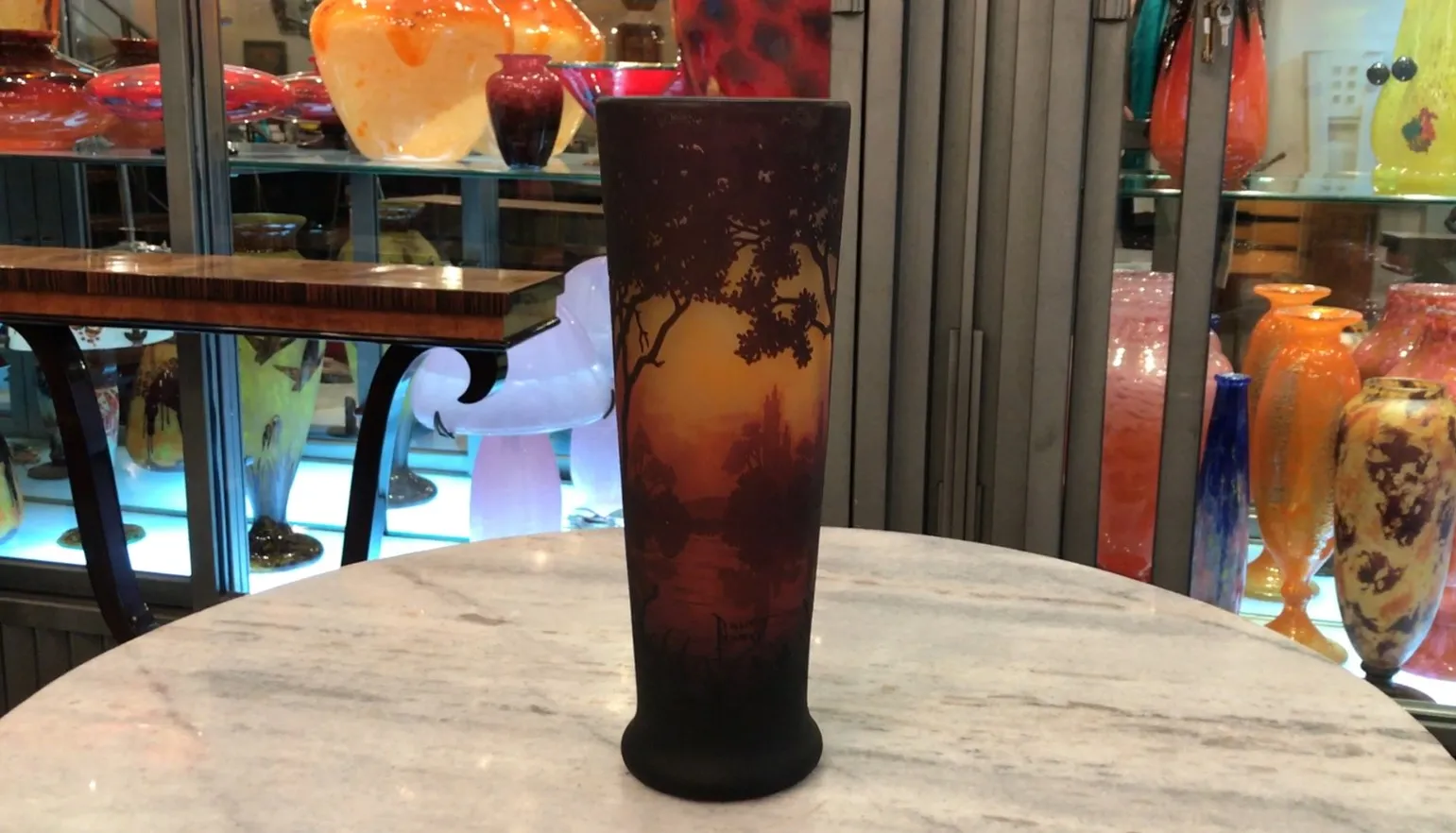 vase with landscapes and Daum Nancy signature on dark background