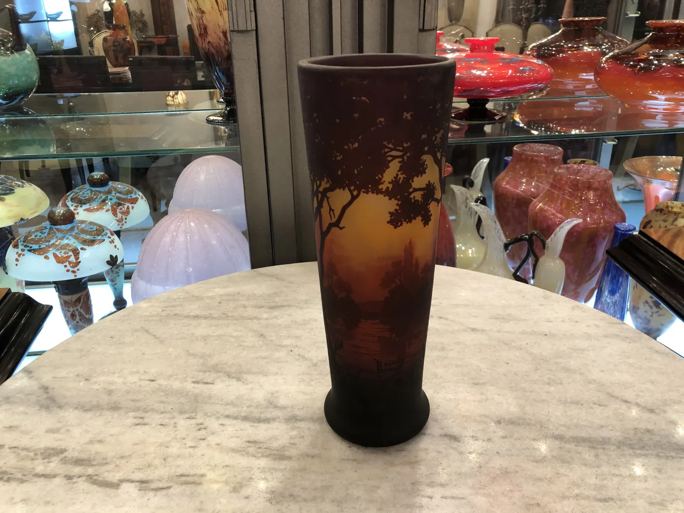 Signed glass Daum Nancy with artistic decorations on dark background